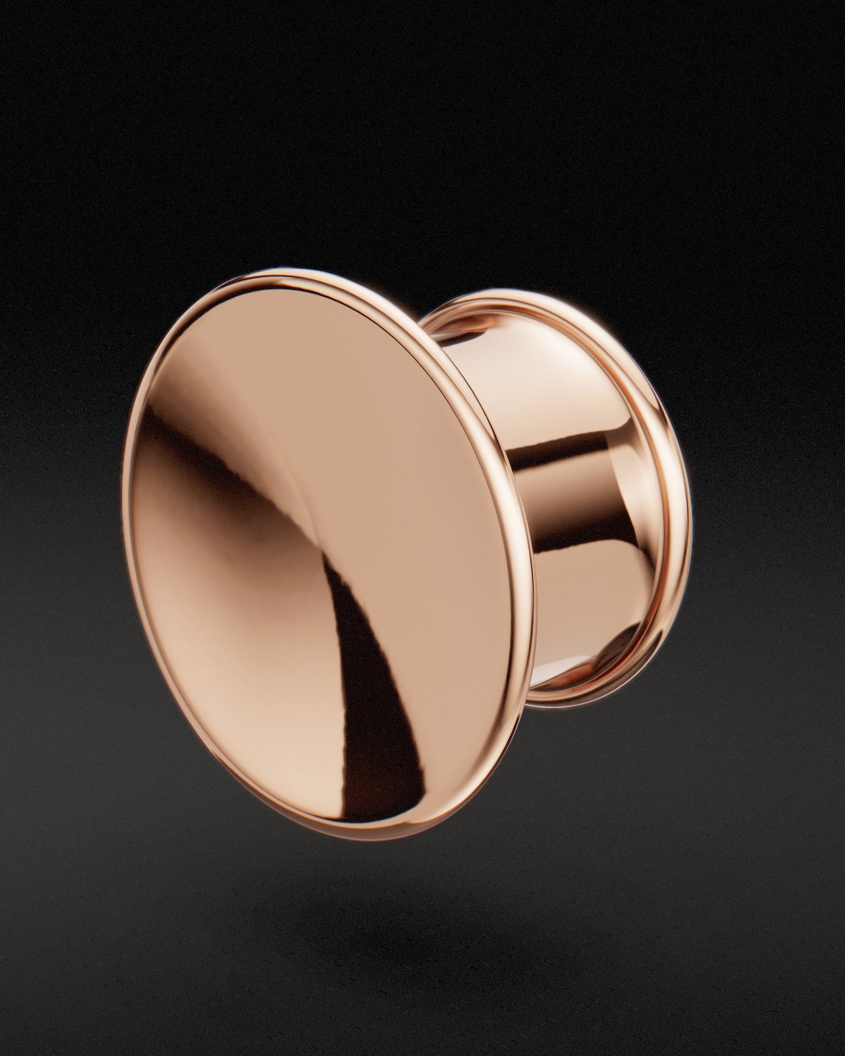 9ct rose gold Mayan flare ear tunnel with polished concave face, three-quarter view