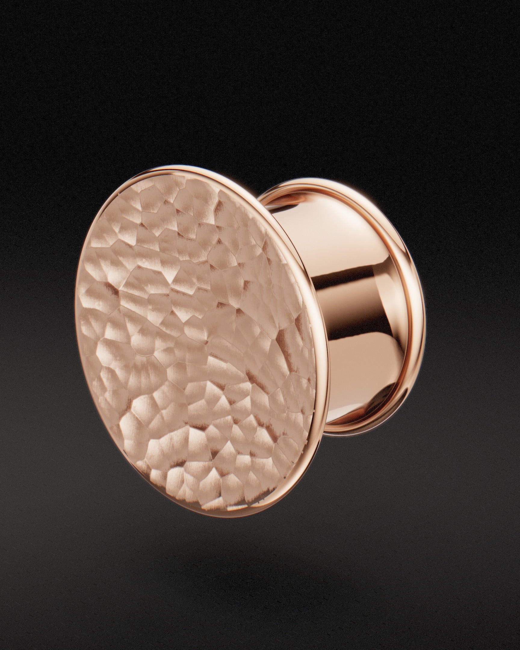 Rose gold Mayan flare ear tunnel with concave hammered face, three-quarter view